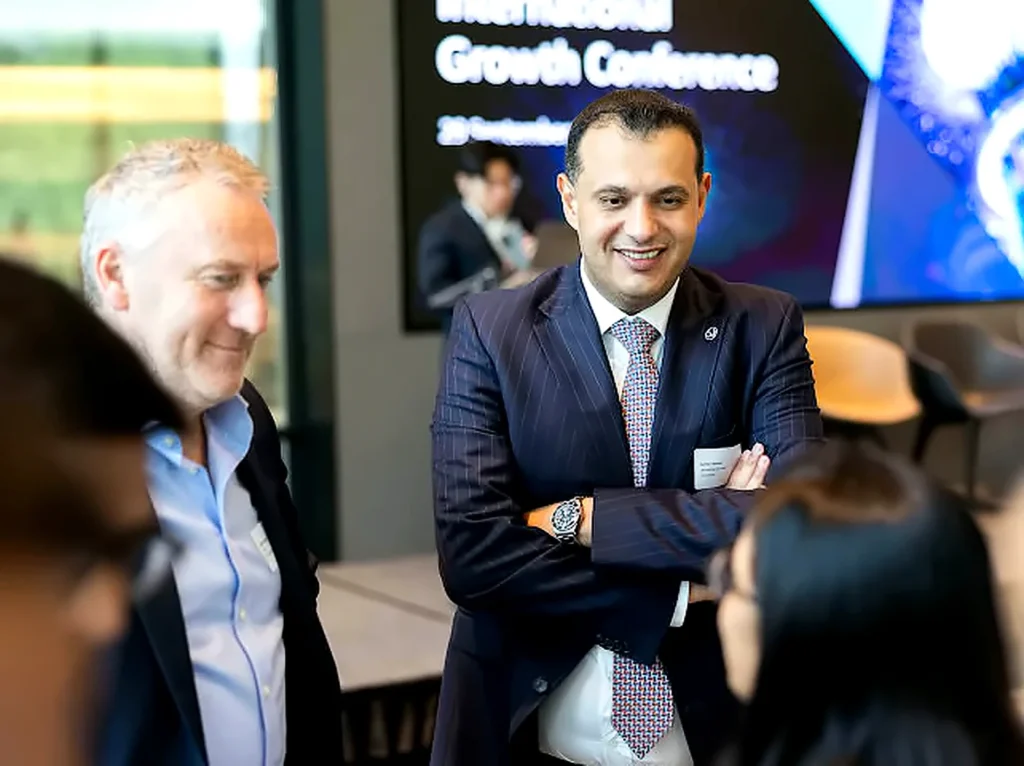 Samer Ali Hasan meeting attendees at the International Growth Conference
