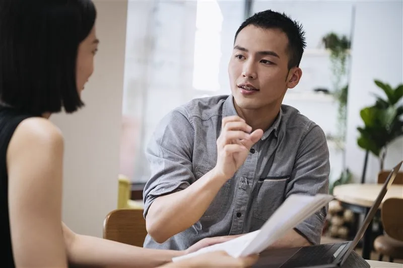 Colleague explaining a point during a meeting