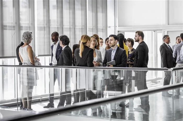 Business professionals gathered on a glass balcony