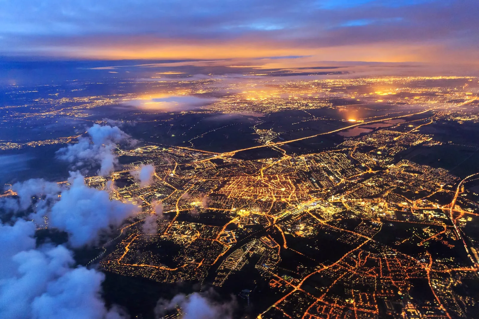 Connected city lights at dusk representing global networks